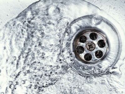 water flowing down a sink drain